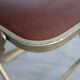 2 golden metal chairs with faux leather in the 60s/70s Opera style.