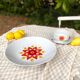 Hollow round plate duo and gravy boat in Winterling porcelain, 1970.