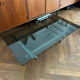 70s design coffee table in rectangular glass with chrome legs.