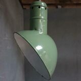 Old industrial enamel lamp in green