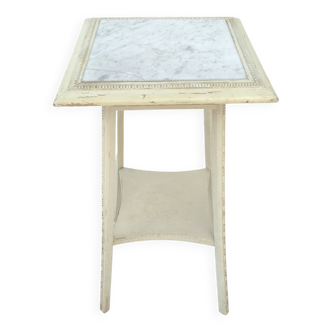 White wooden stand with marble top.