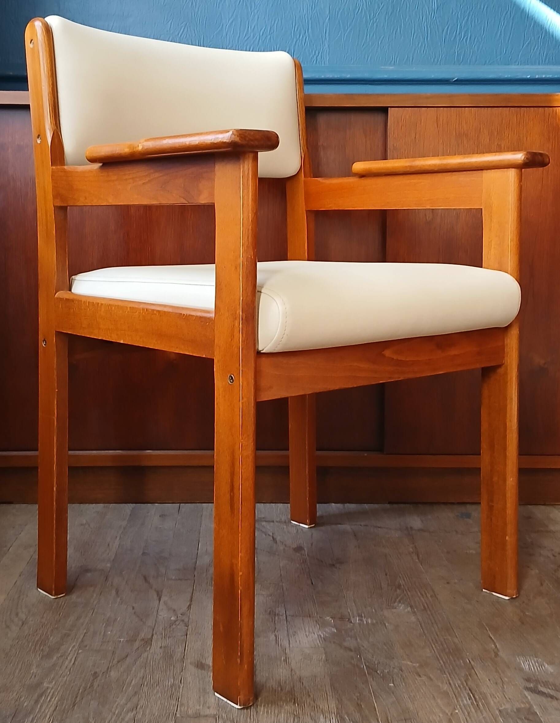 Armchair by André Sornay, stained solid beech & beige faux leather. 1980