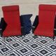 Vintage armchairs in red and black faux leather, the pair.