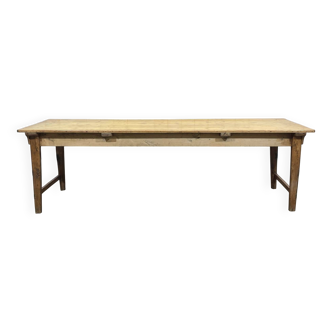 Early 20th-century farmhouse table made of fir, elm, and chestnut.