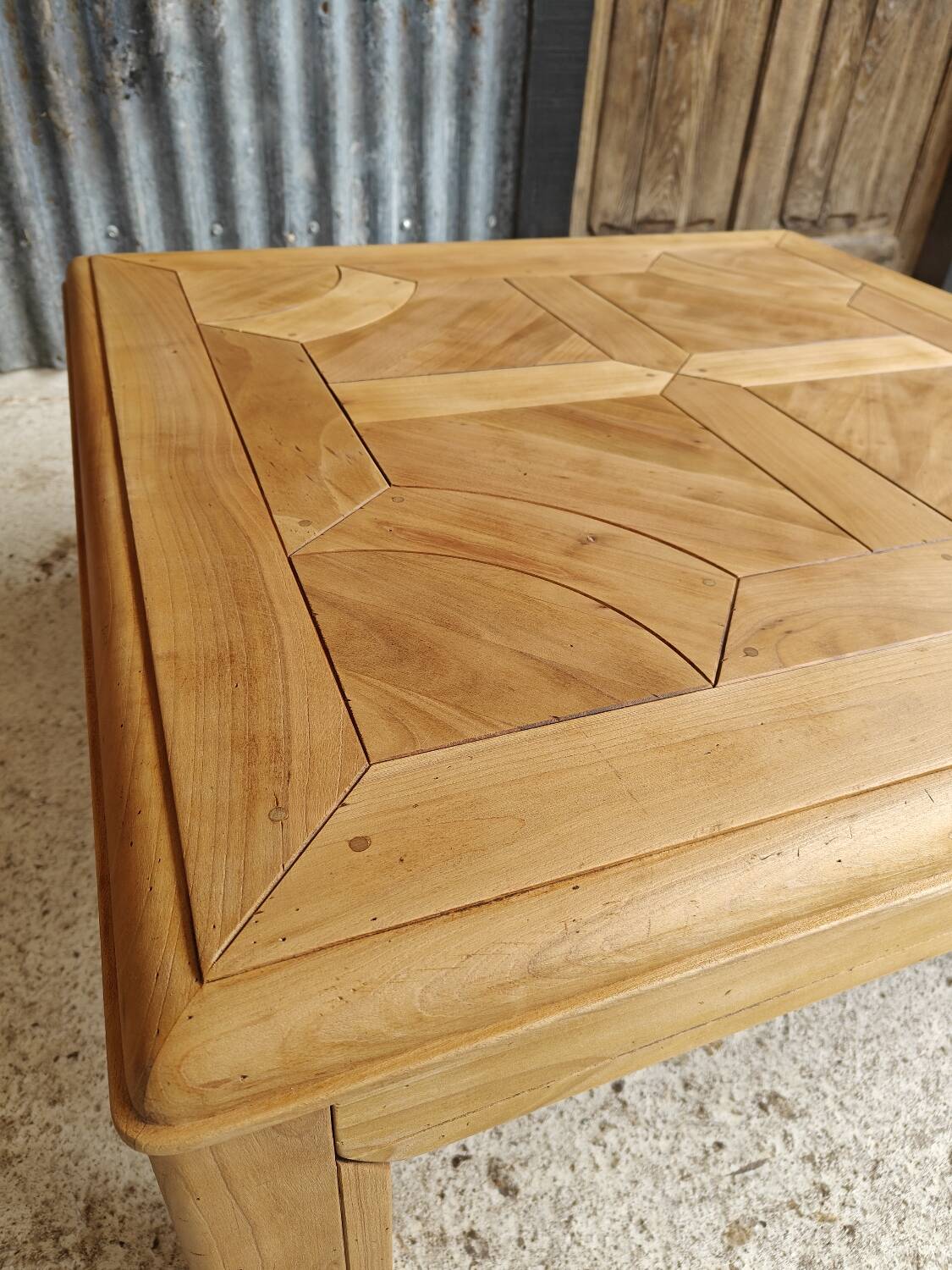 Square coffee table with a drawer in cherry wood.
