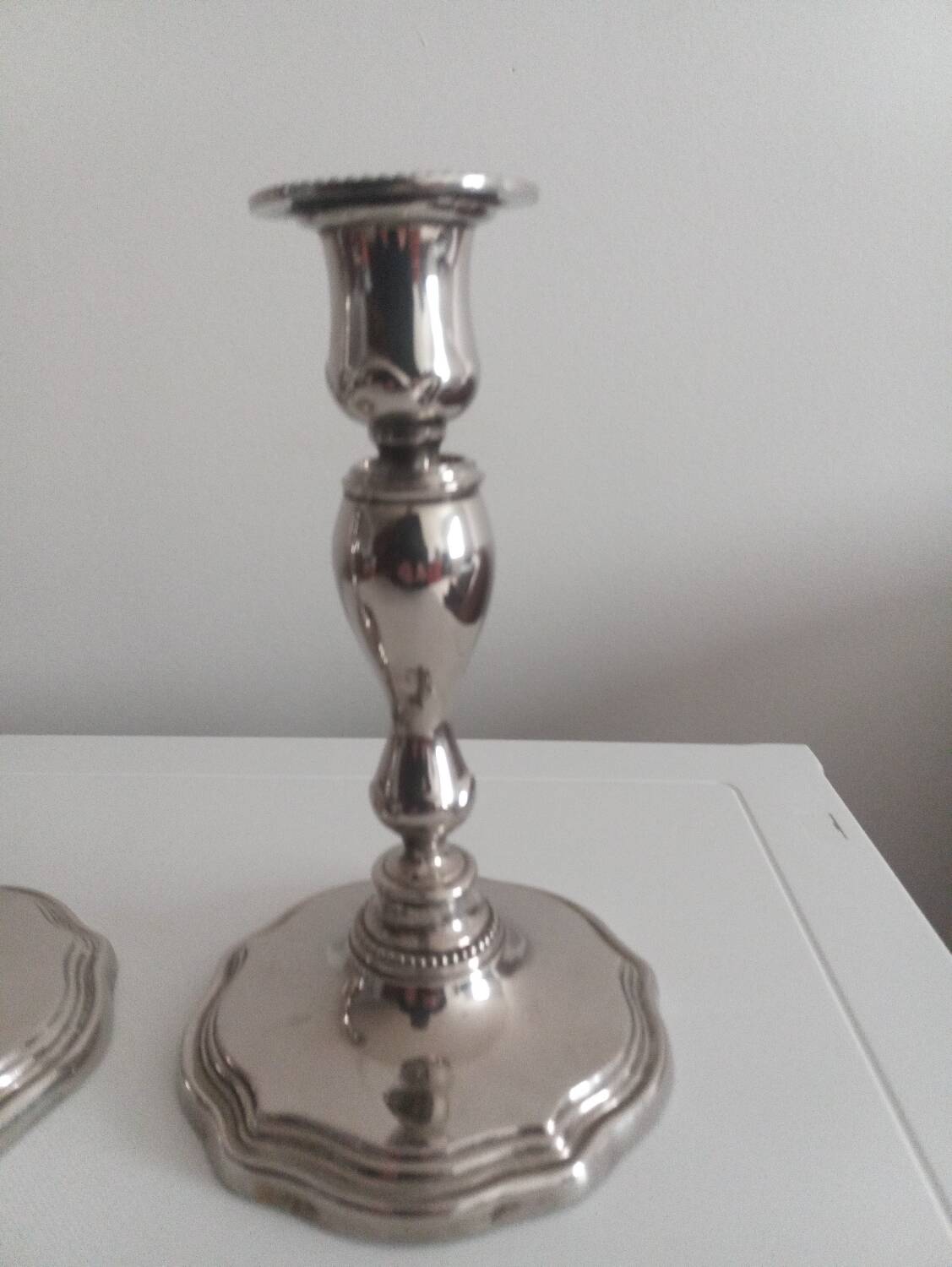 Pair of silver-plated metal candlesticks