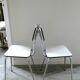 Pair of white formica and slender feet of the 60s Chair