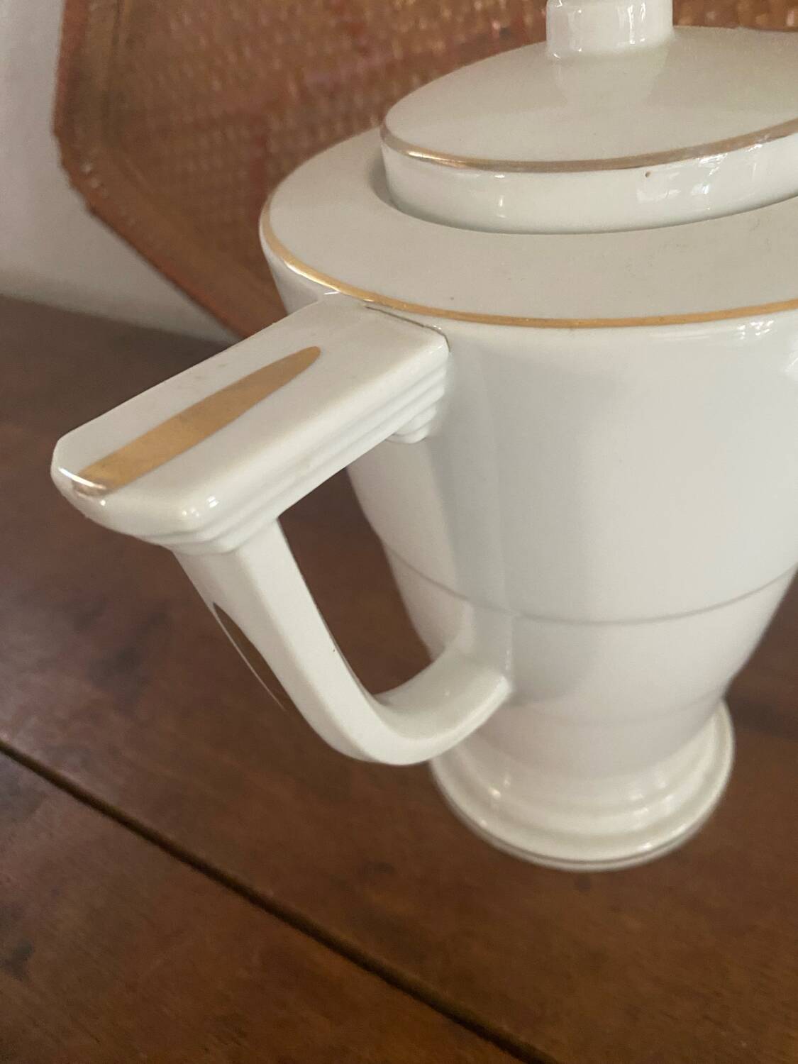 White and gold porcelain coffee pot in art deco style.