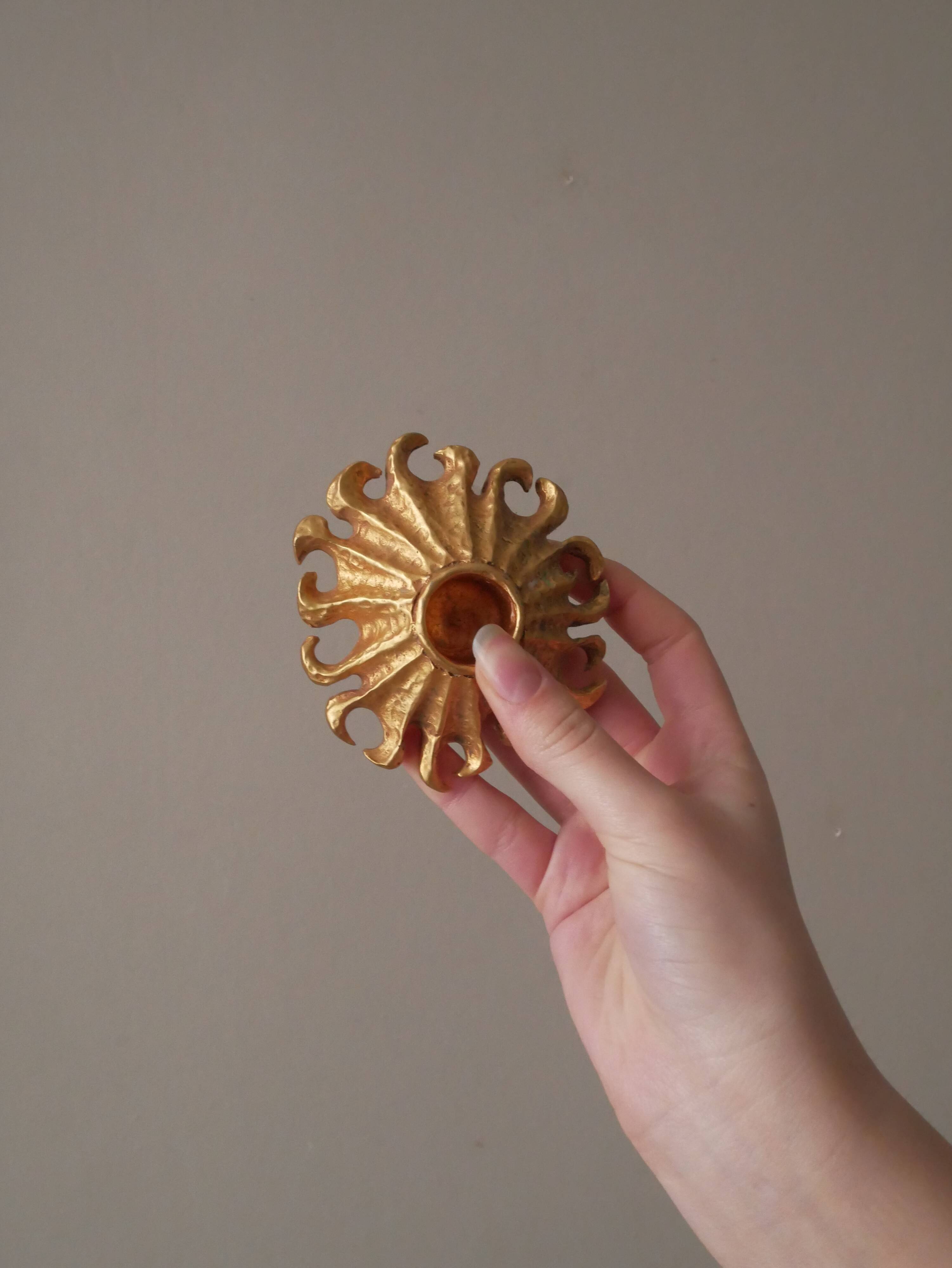 Pair of gold metal candle holders