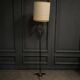 1960 floor lamp on gold metal winged base with black barrel