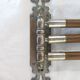 Antique towel rack has three arms