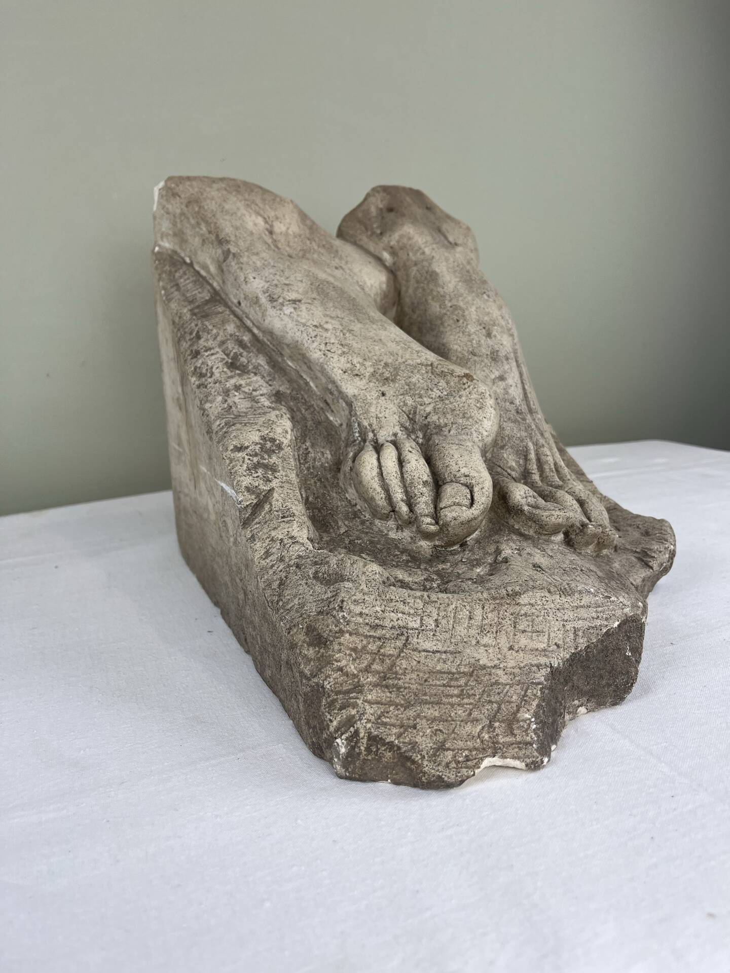 Stone sculpture, two feet on a block, signed D. Paillot.