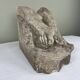 Stone sculpture, two feet on a block, signed D. Paillot.