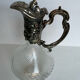 Glass decanter and silver metal frame