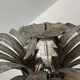 Silver wrought iron sunburst wall light from the 1960s.