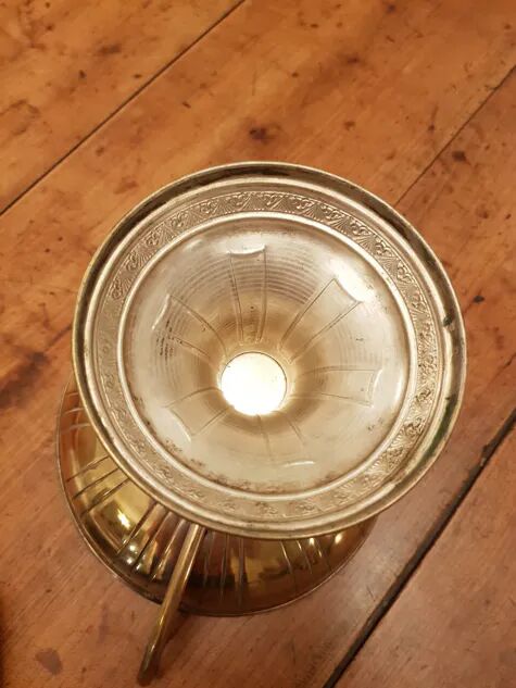 Art Deco brass cup and its engraved saucer.