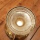 Art Deco brass cup and its engraved saucer.