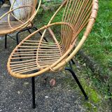 Vintage rattan armchair with metal legs