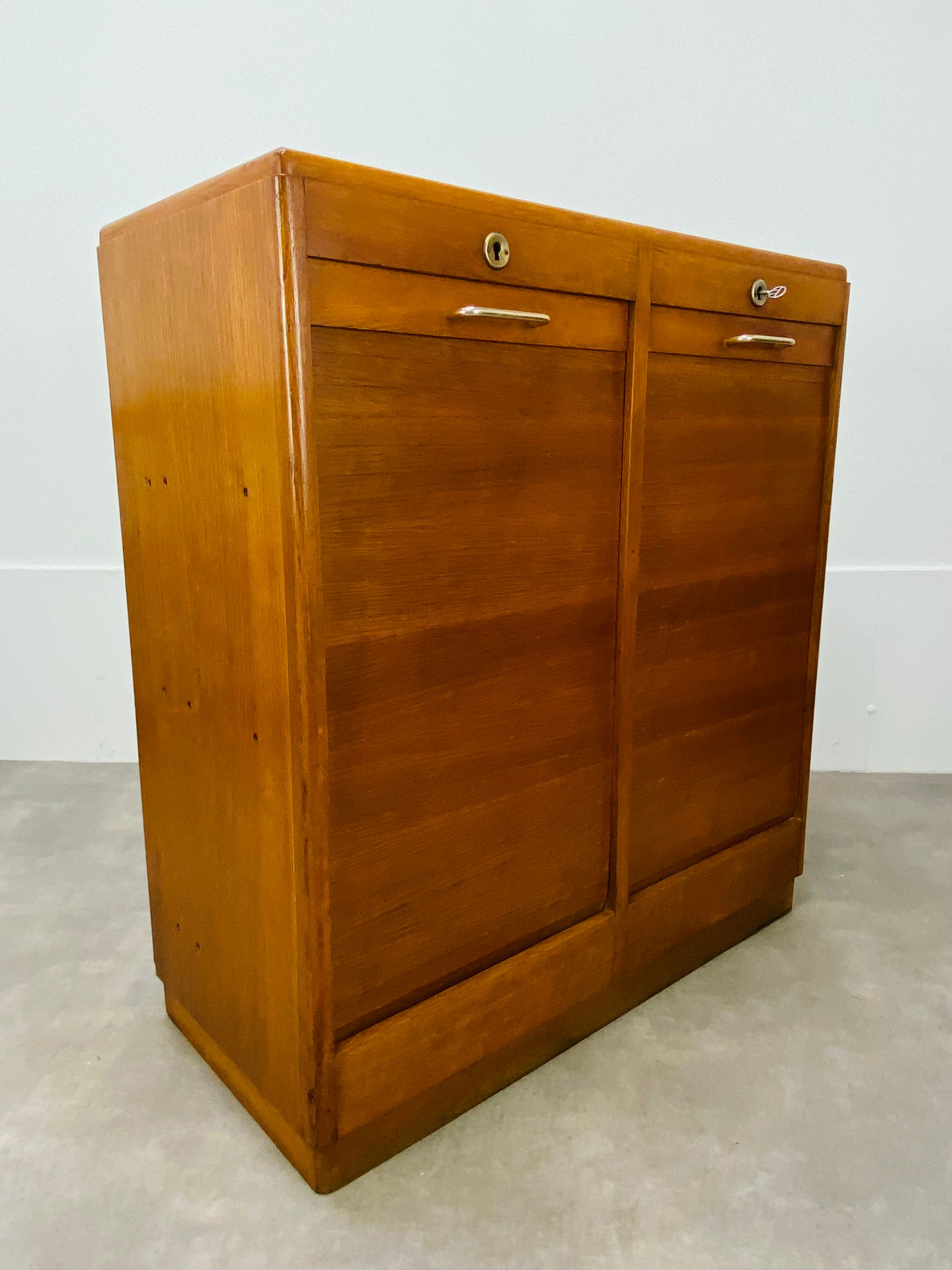 Double curtain binder cabinet