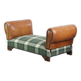 Antique daybed reupholstered with sheepskin and Scottish tartan wool