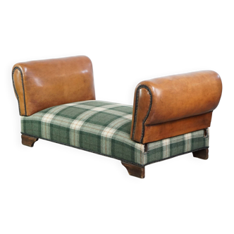 Antique daybed reupholstered with sheepskin and Scottish tartan wool