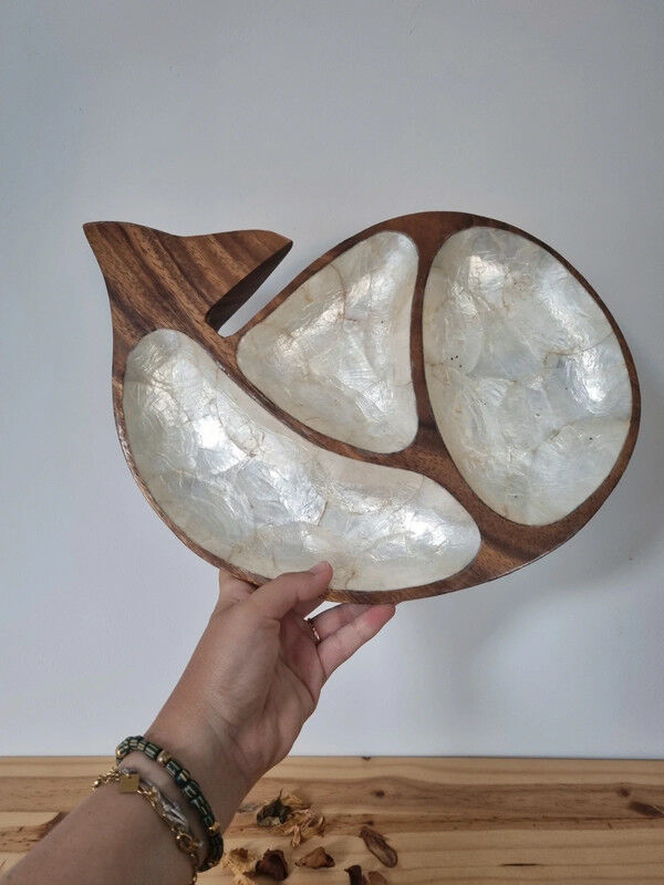 Empty wooden and mother-of-pearl whale pocket display