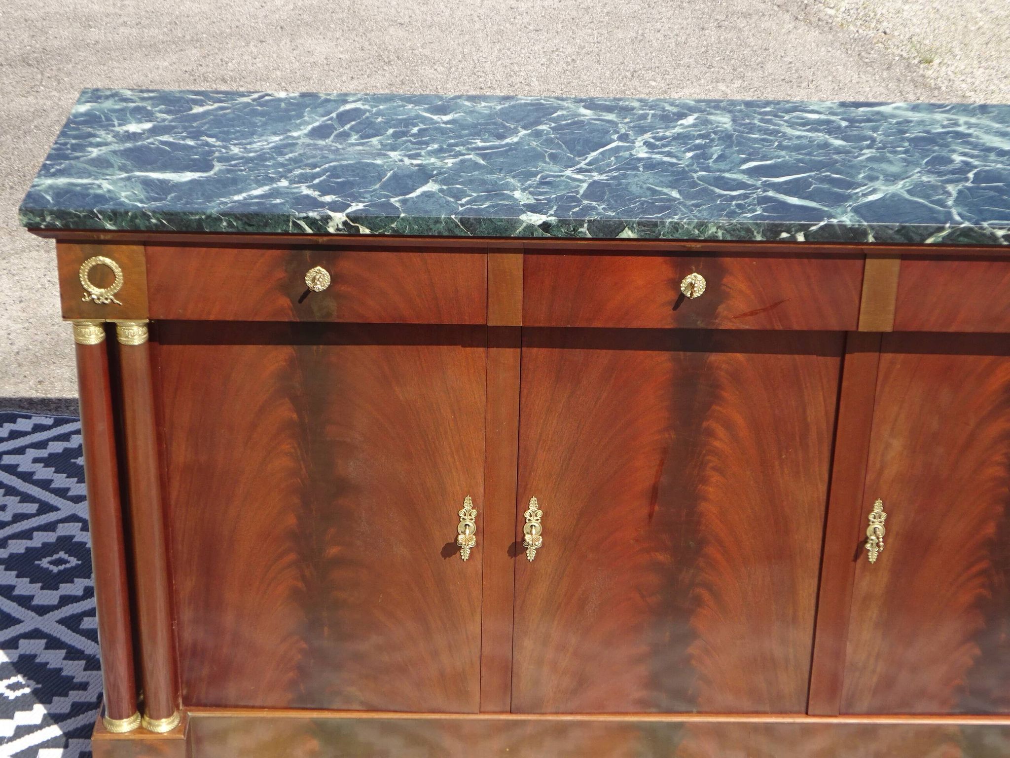 Flamed mahogany enfilade with sea green marble in Empire style.