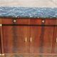 Flamed mahogany enfilade with sea green marble in Empire style.