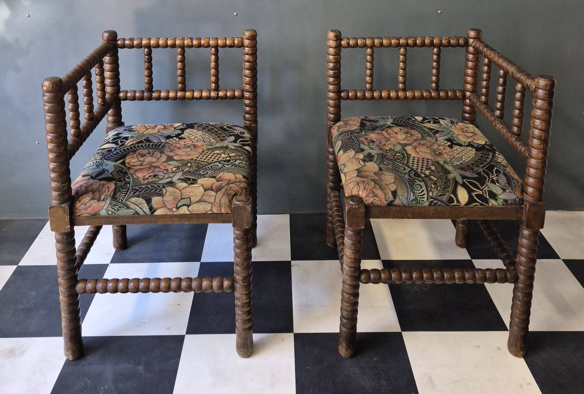 Old pair of corner chairs known as 'fireplace corner' armchairs.