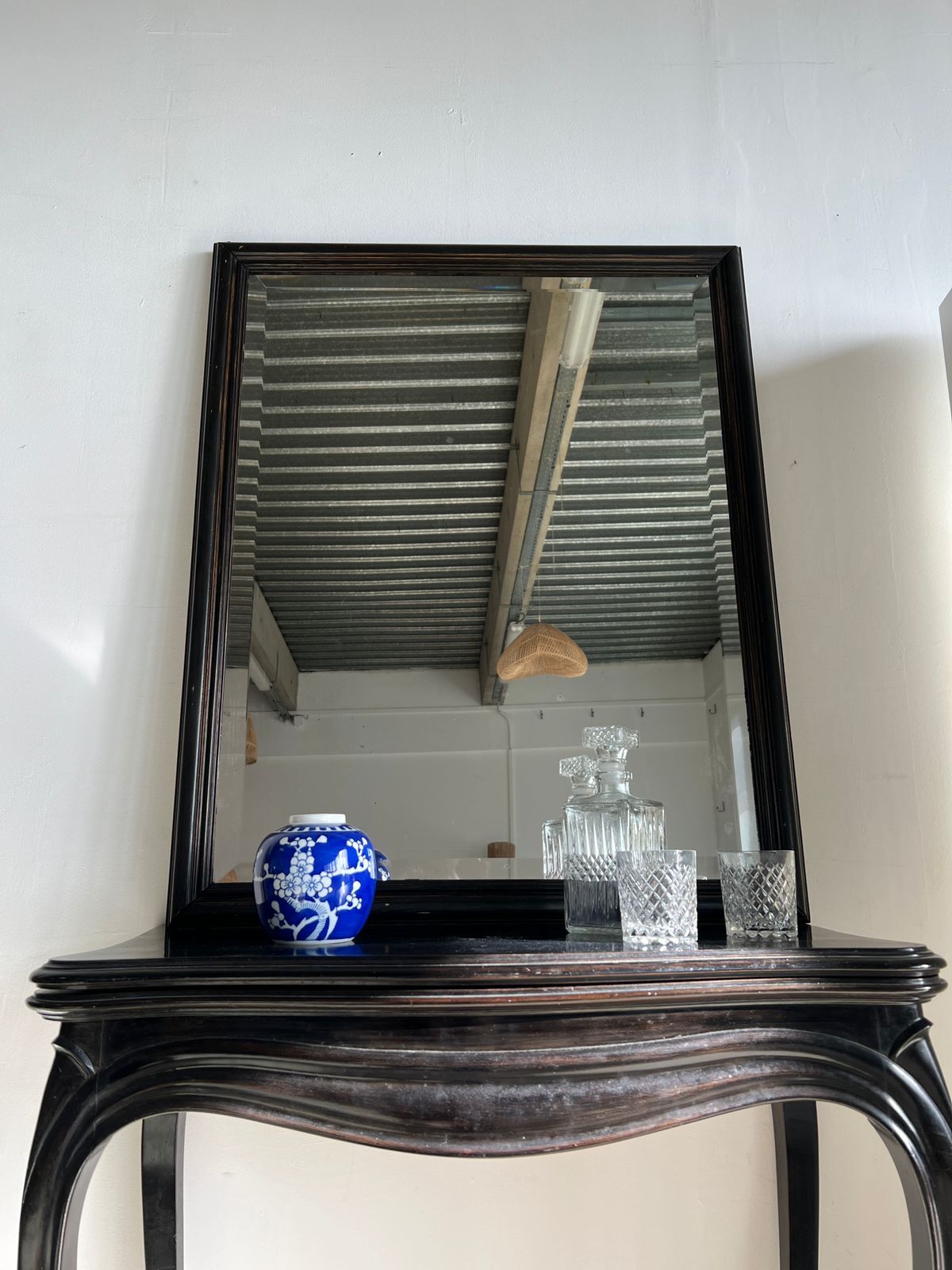 Rectangular mirror in molded blackened wood, beveled glass