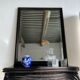 Rectangular mirror in molded blackened wood, beveled glass