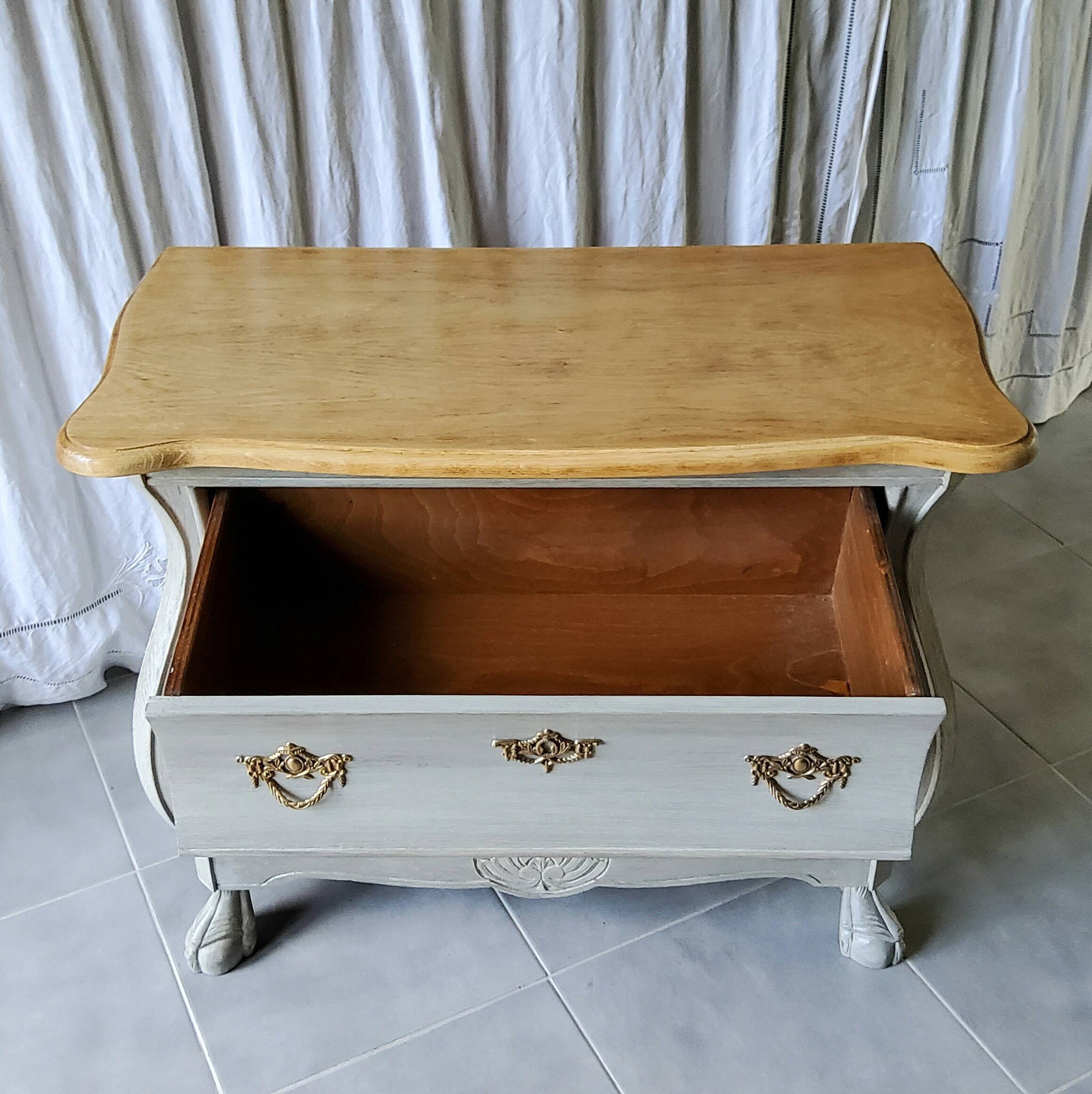 Curved patinated chest of drawers