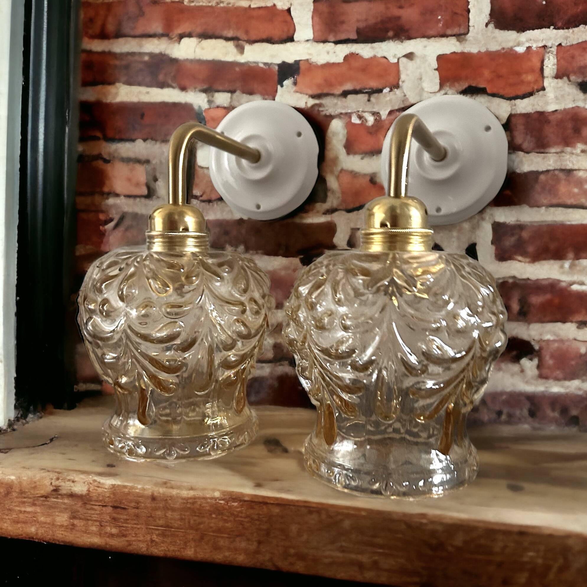 Set of two vintage amber glass wall lights