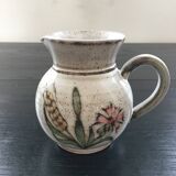 Signed pitcher with thistle decoration