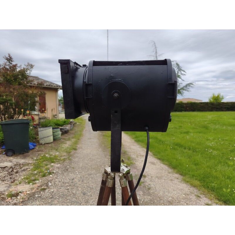 Spotlight on wooden and chrome tripod.