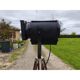Spotlight on wooden and chrome tripod.