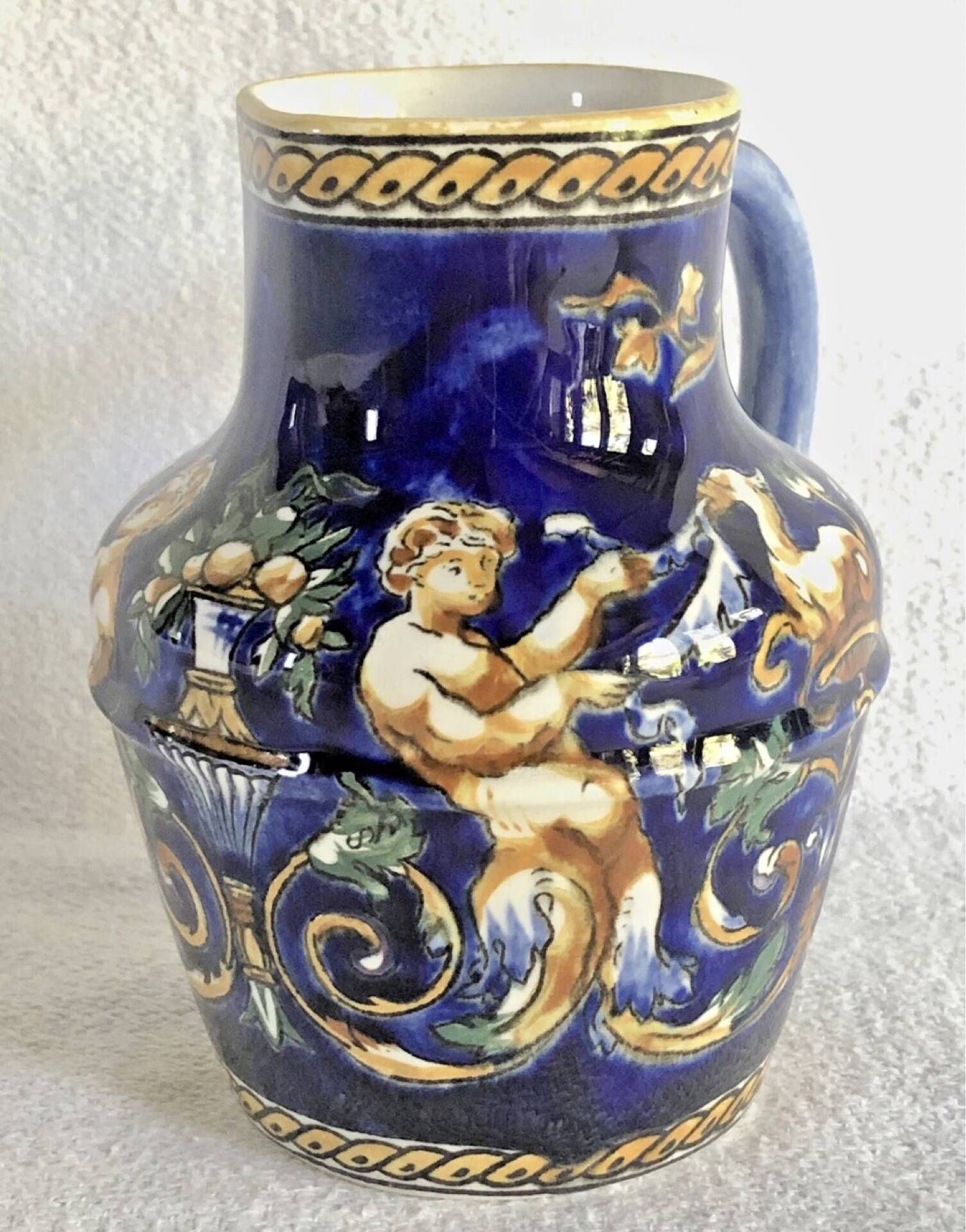 Old cream jug Gien Renaissance blue background 1938/1960