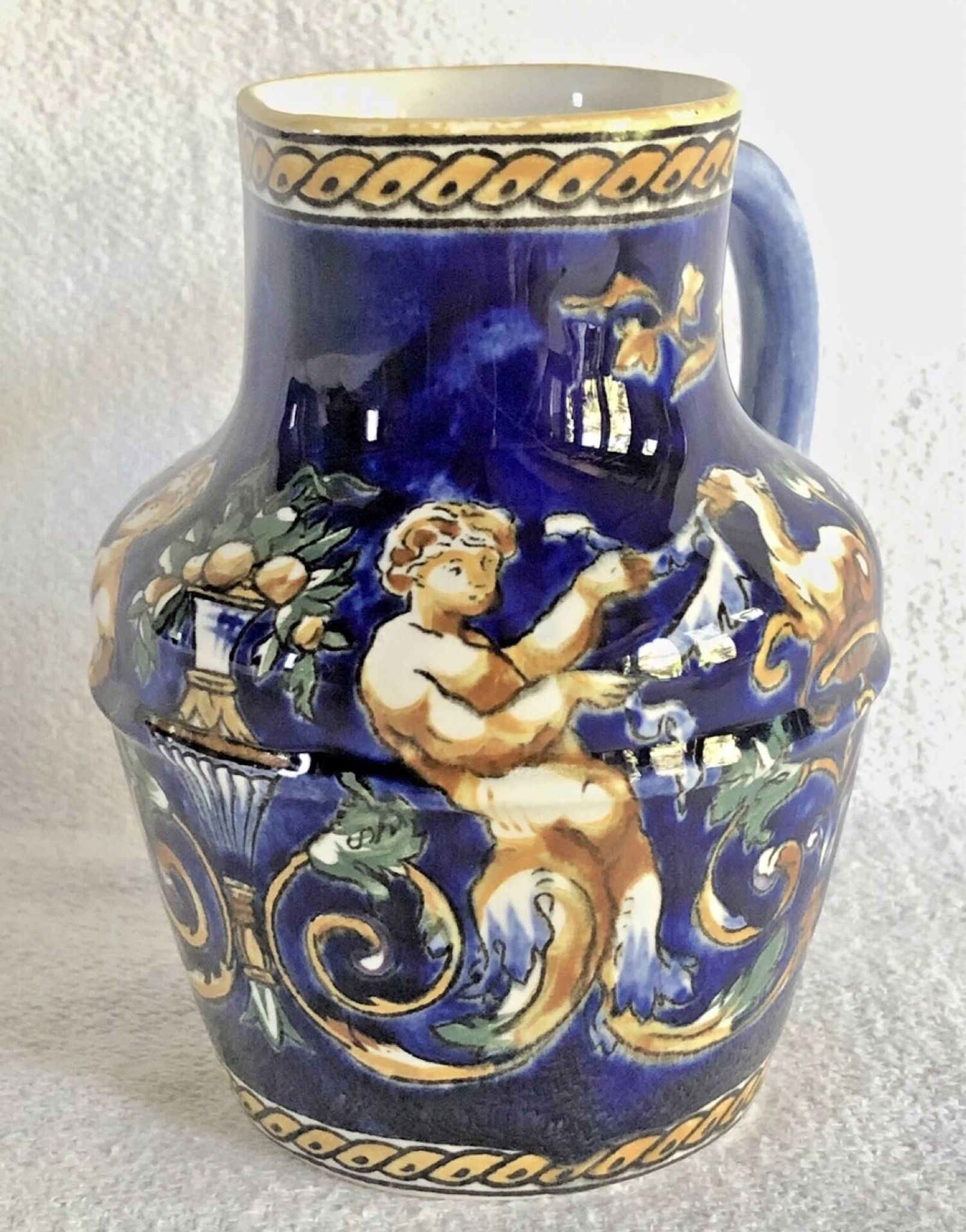 Old cream jug Gien Renaissance blue background 1938/1960