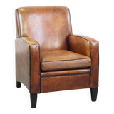 Fauteuil design en cuir de mouton vintage confortable avec un look robuste