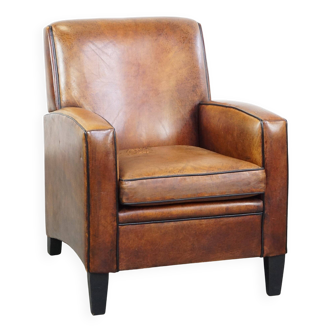 Comfortable vintage sheepskin leather design armchair with a rugged look