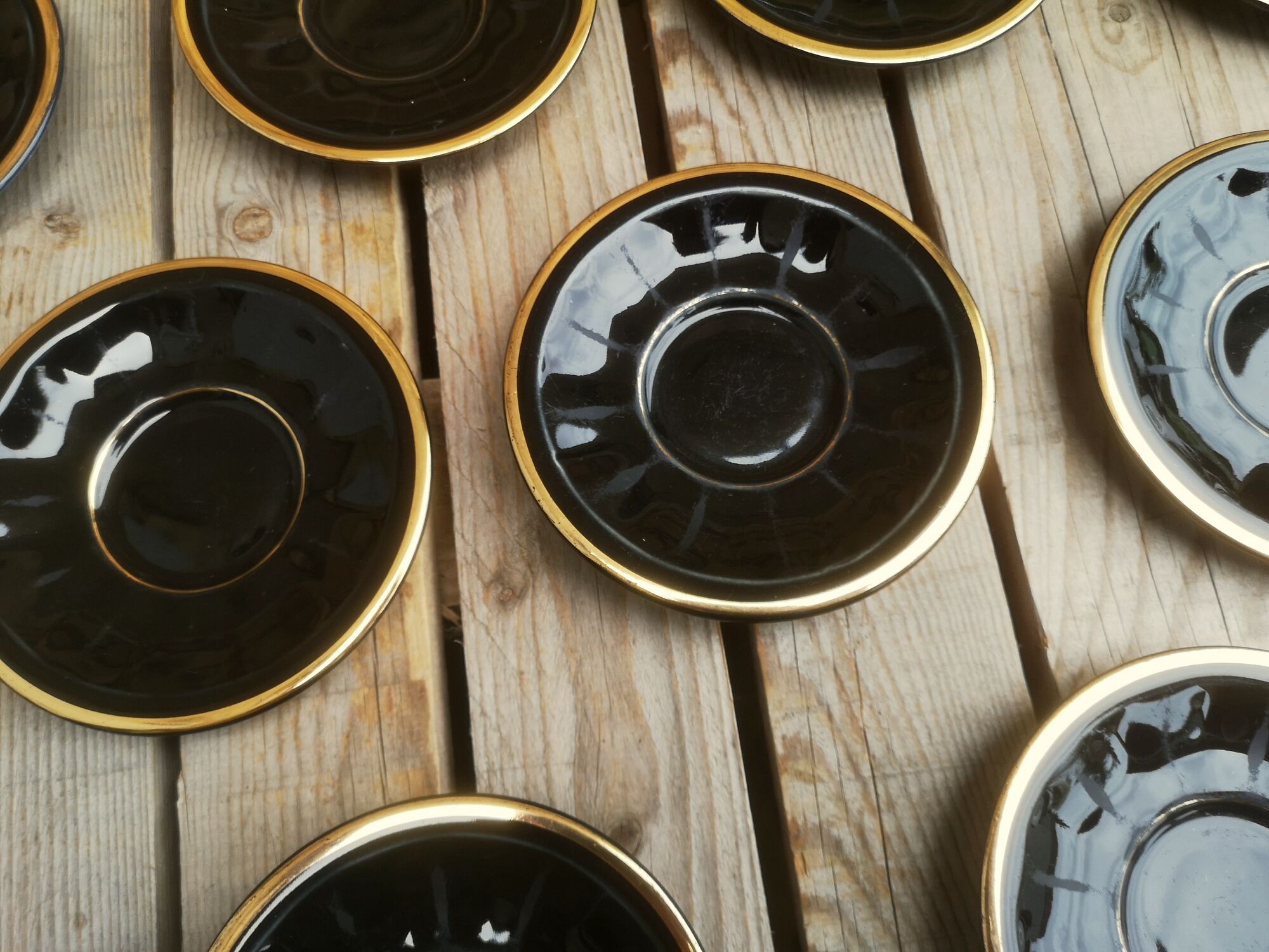 Set of 9 cups and sub-cups in black ceramic and colored gold border