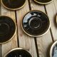 Set of 9 cups and sub-cups in black ceramic and colored gold border