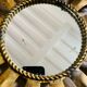 Golden metal sun mirror