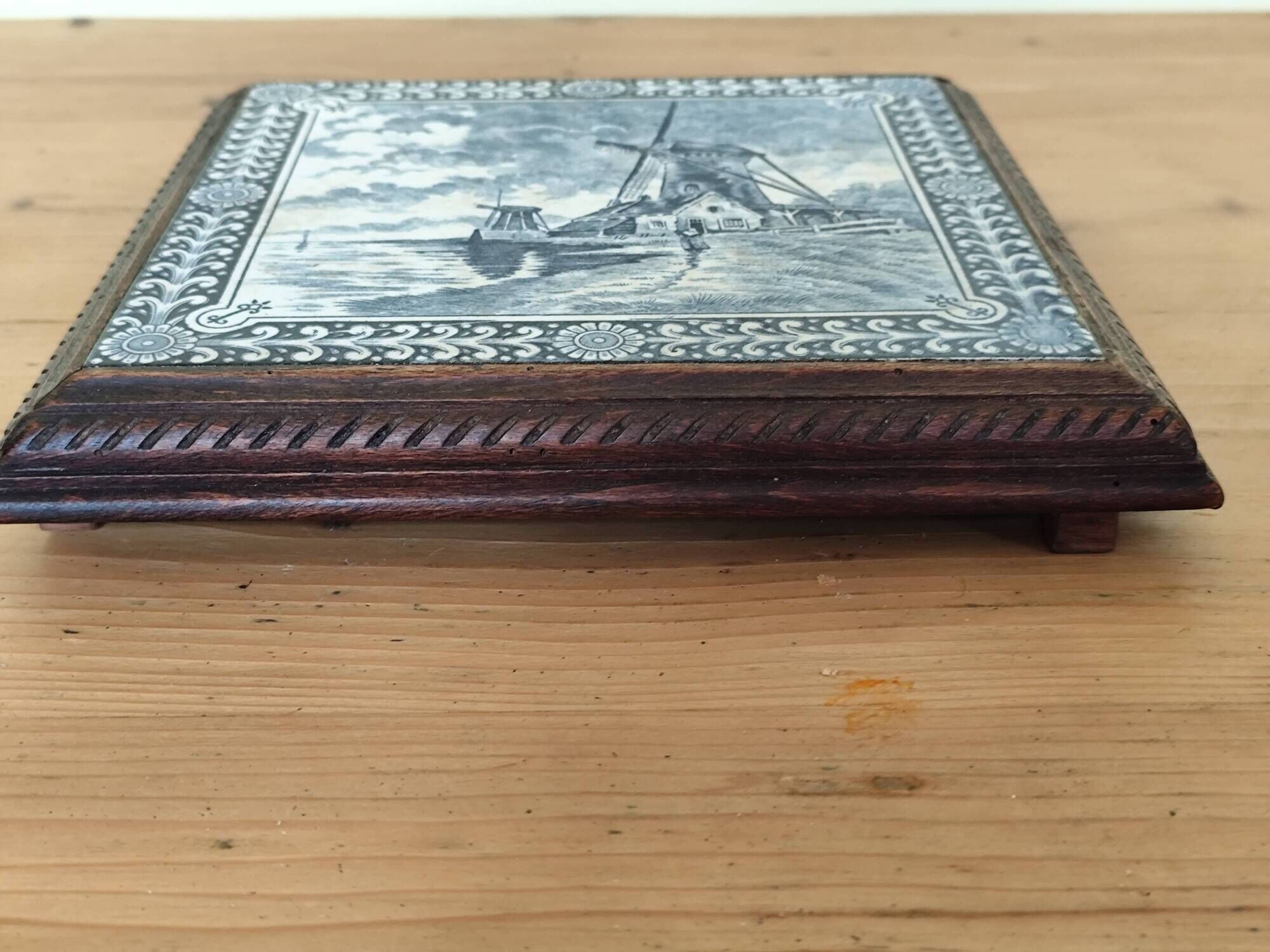 Ceramic tile trivet and wooden frame with Dutch windmill.