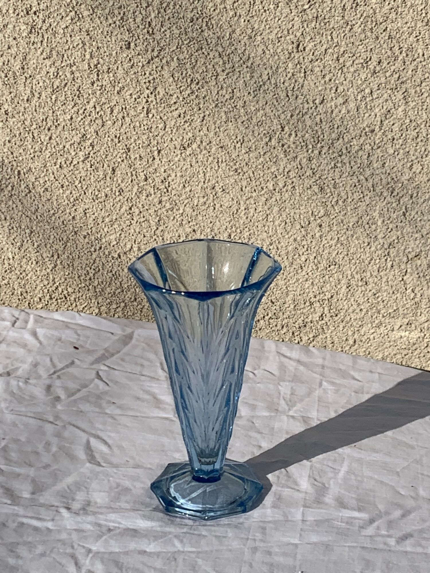 Blue molded glass vase in art deco relief
