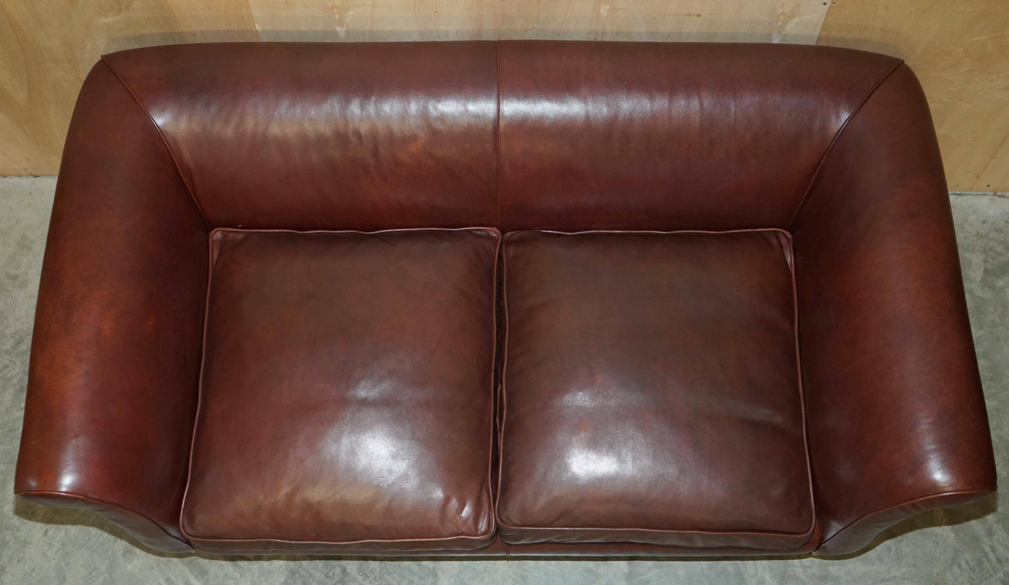 Vintage Art Deco leather sofa, three-seater, feather cushions.