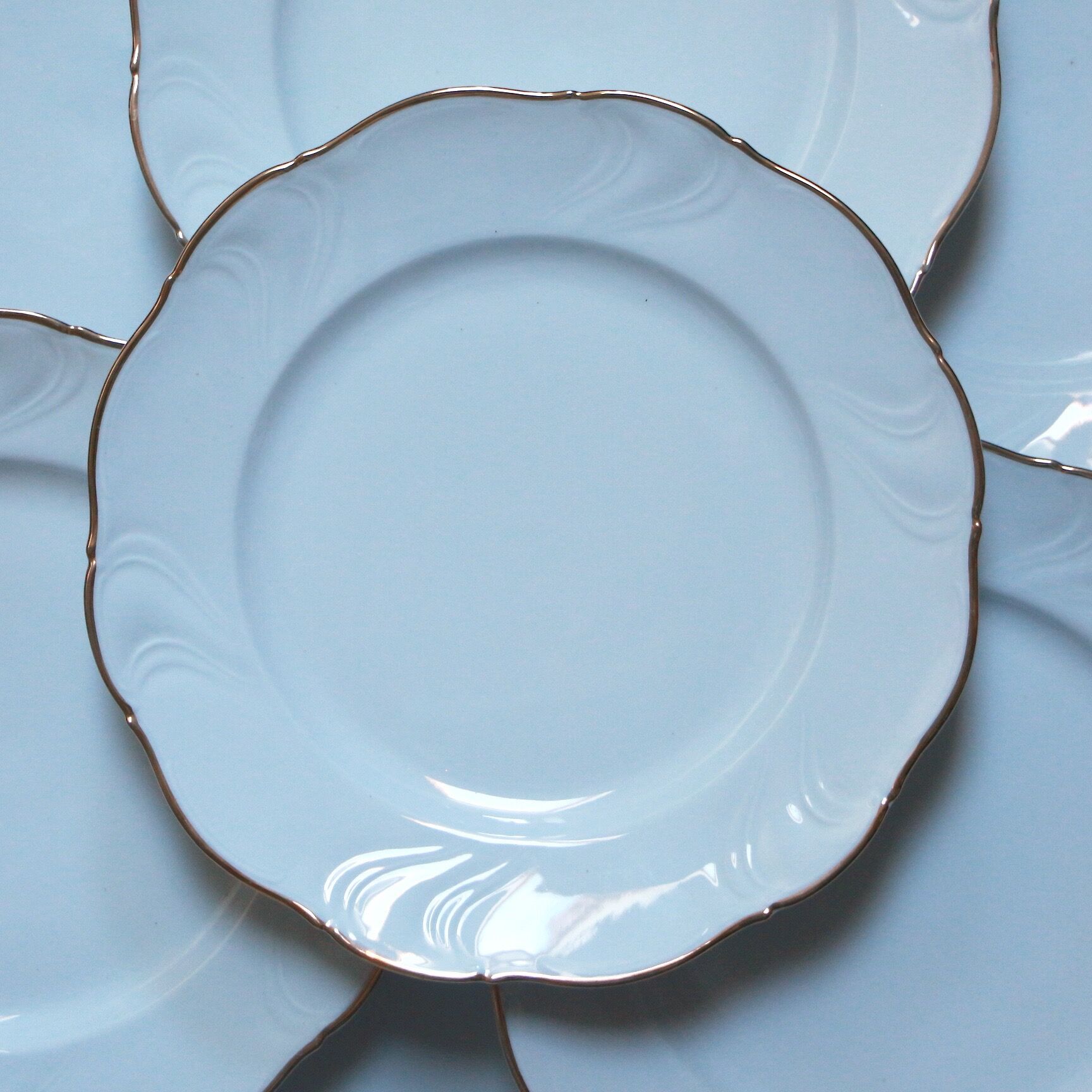 White and gold porcelain plates