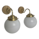 A pair of vintage opaline and brass wall lights
