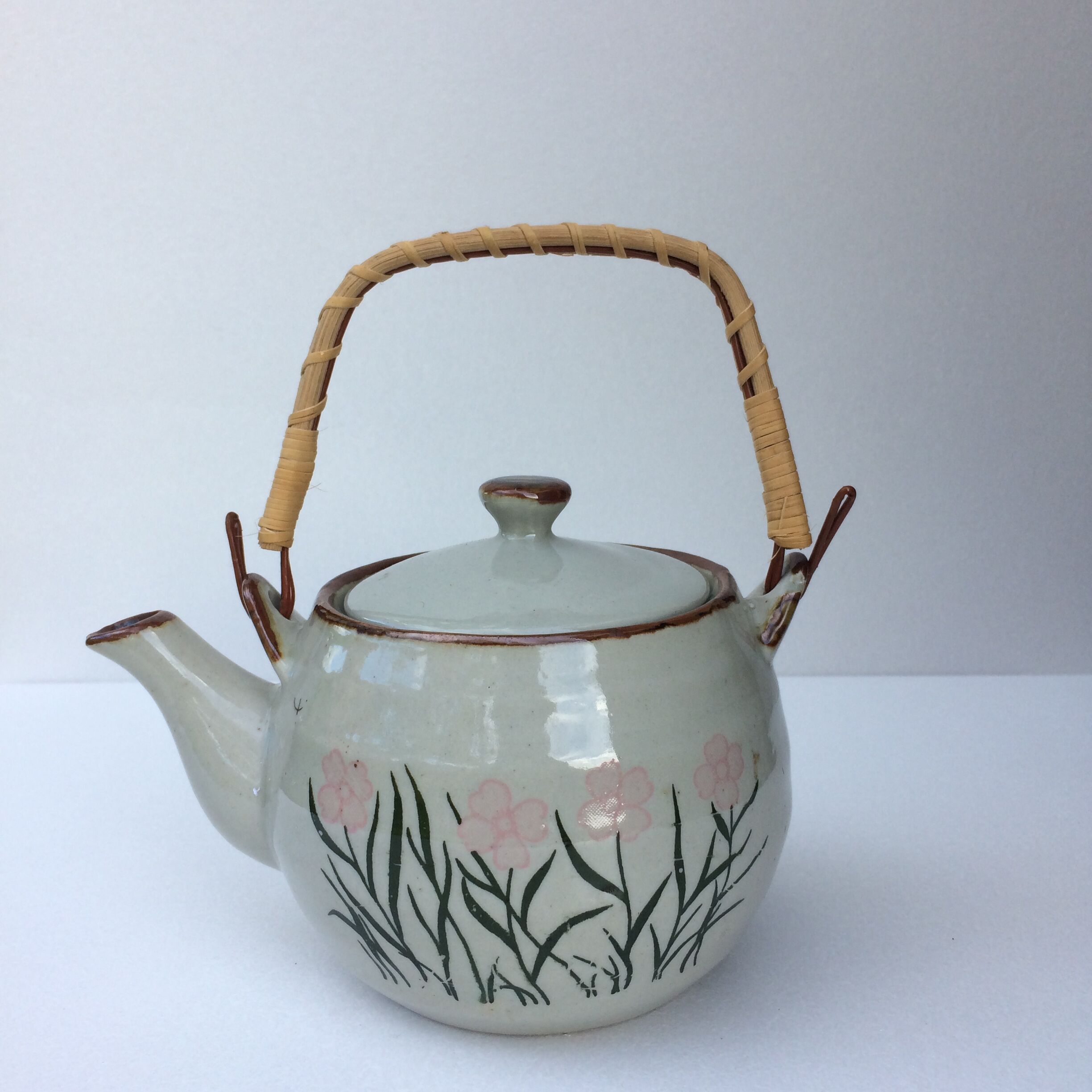 Vintage teapot wicker handle