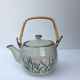 Vintage teapot wicker handle